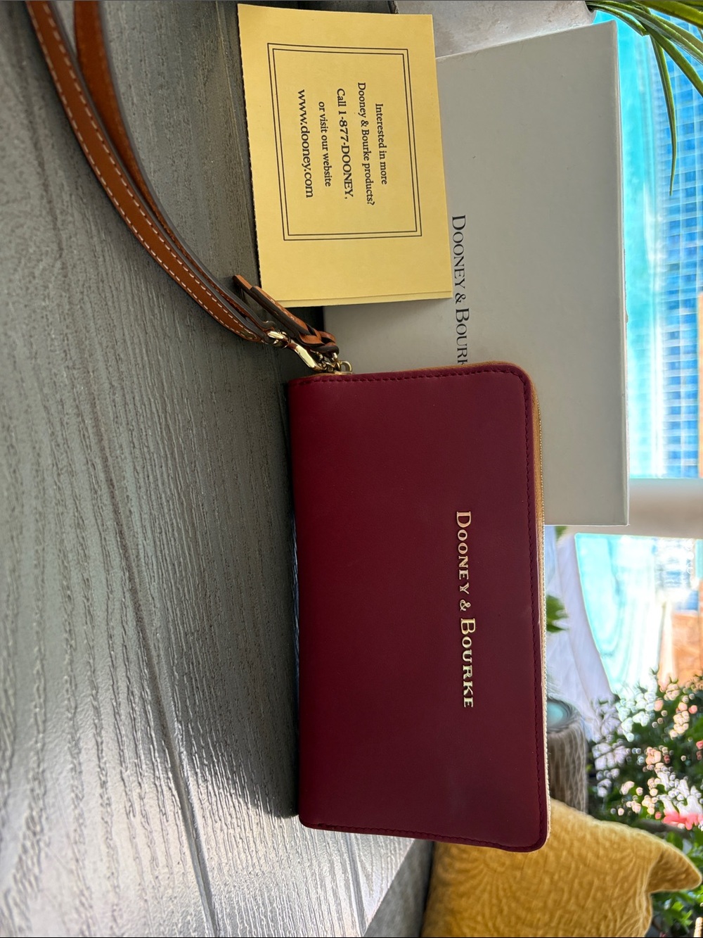 Dooney & Bourke Burgundy Zip Wristlet with Tan Strap